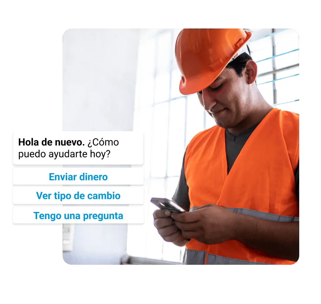 Un trabajador de la construcción mira su teléfono, en el que se ven las opciones de Remitly para enviar dinero, ver los tipos de cambio o hacer una pregunta.