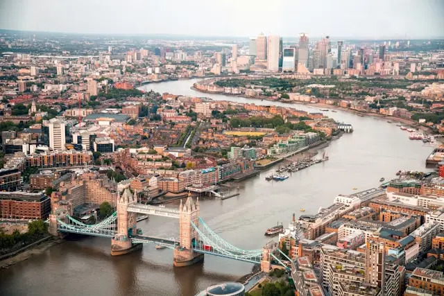Aerial view of London, UK, with tower bridge in the foreground on the river Thames