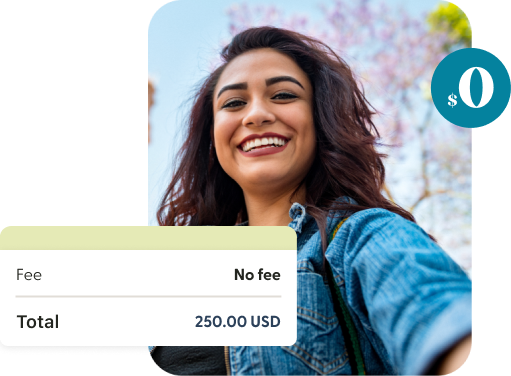 A woman smiling beside a screen showing a money transfer with no fee.