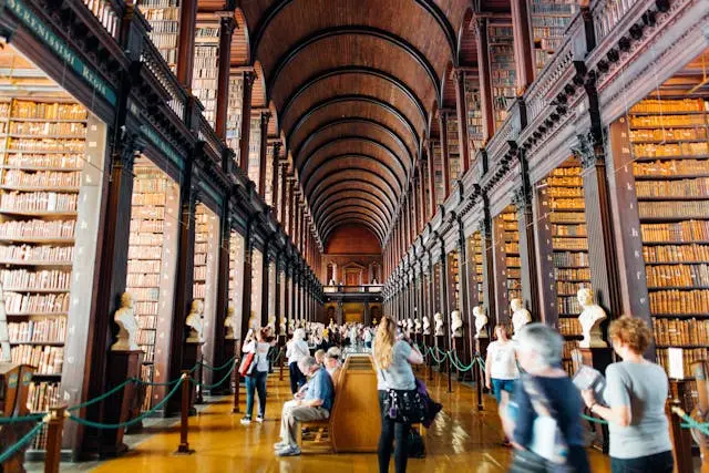 Visitors walking through Trinity College Library in Dublin, Ireland.