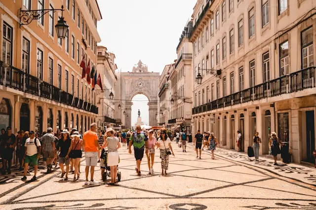 People walking down Rua da Rosa in Lisbon, Portugal.