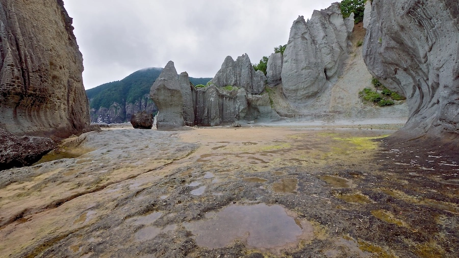 Towering rock pillars at Hotokegaura, Sai village, Aomori, sculpted by wind and waves along the rugged coastline.